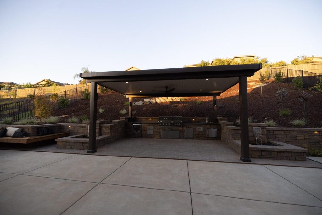 Block retaining walls around a patio on a sloped backyard